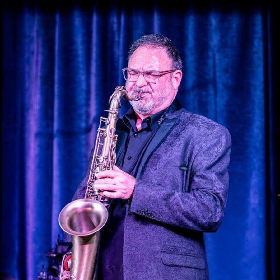 Sanford Marten performing live on saxophone for What the World Needs Now